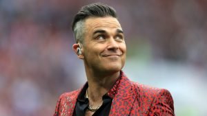 Cartelera | Robbie Williams: de ídolo pop a arrancarse la piel, la historia detrás de “Rock DJ”